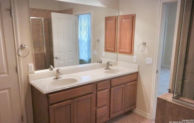 3526 Arroyo Grande, San Antonio, TX 78253 - bathroom featuring double vanity, a shower with shower door, and baseboards