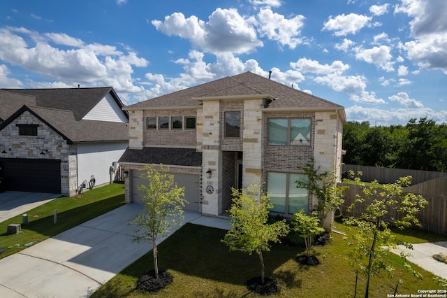63 Ricadonna, San Antonio, TX 78253 - view of front of house with a shingled roof, driveway, stone siding, and brick siding