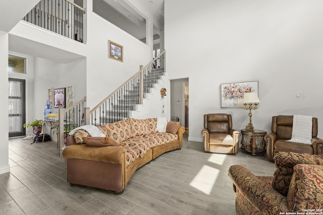 63 Ricadonna, San Antonio, TX 78253 - living room with a high ceiling, wood finished floors, stairs, and baseboards