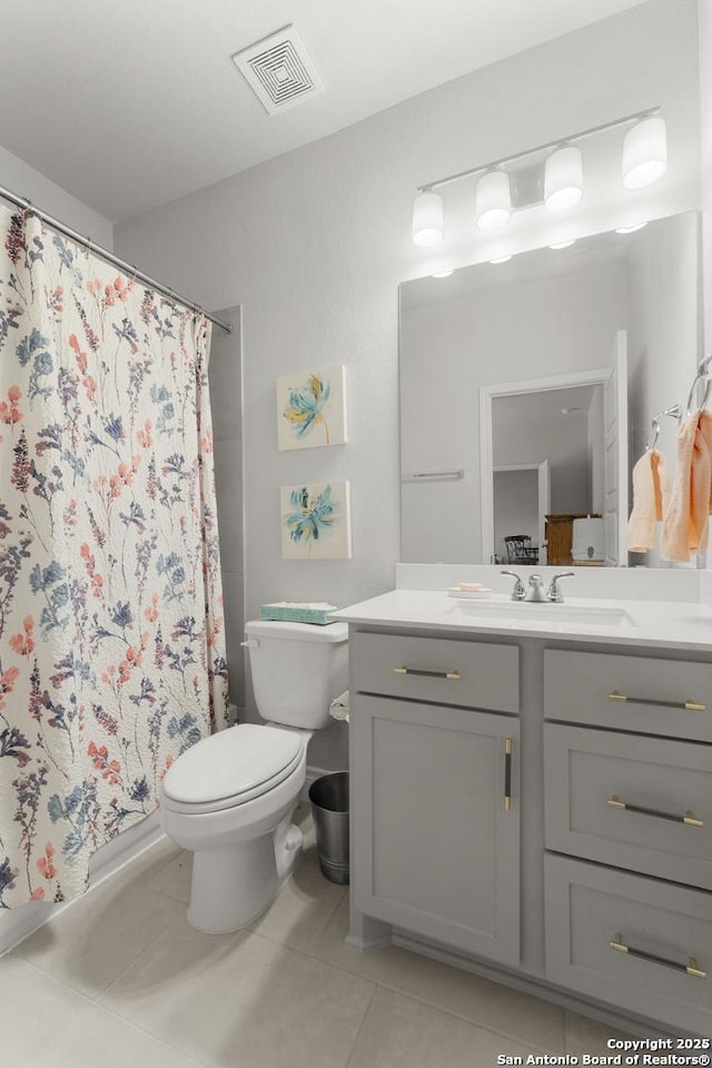 63 Ricadonna, San Antonio, TX 78253 - bathroom featuring tile patterned floors, toilet, vanity, and curtained shower