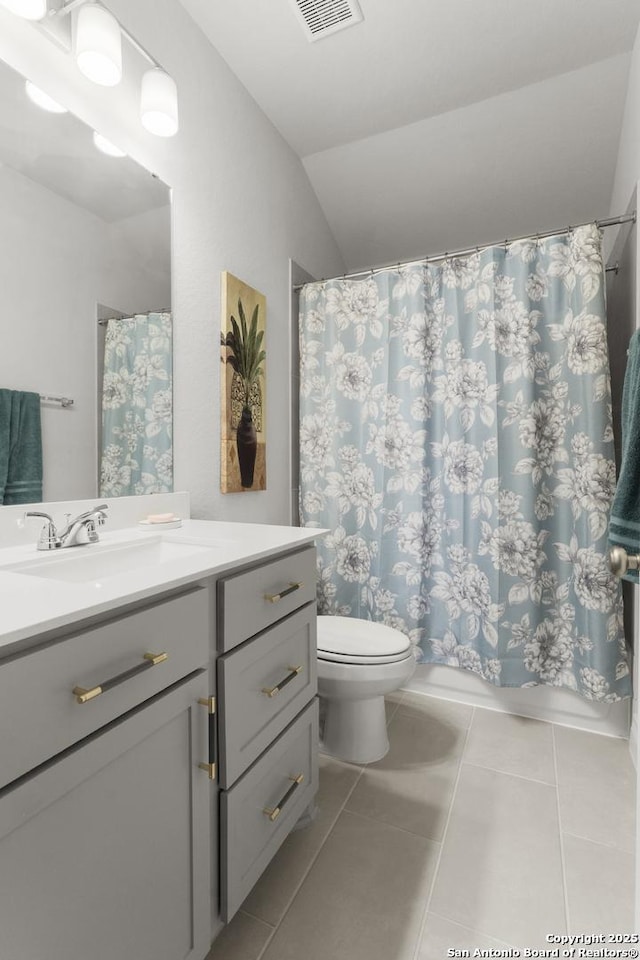 63 Ricadonna, San Antonio, TX 78253 - bathroom featuring lofted ceiling, toilet, vanity, and tile patterned flooring