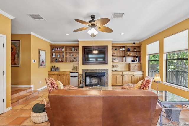 261 Fair Oaks, Alamo Heights, TX 78209 - living room featuring a fireplace, ceiling fan, ornamental molding, light tile patterned floors, and baseboards