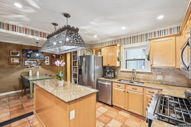 261 Fair Oaks, Alamo Heights, TX 78209 - kitchen featuring appliances with stainless steel finishes, a sink, a kitchen island, light brown cabinetry, and light stone countertops