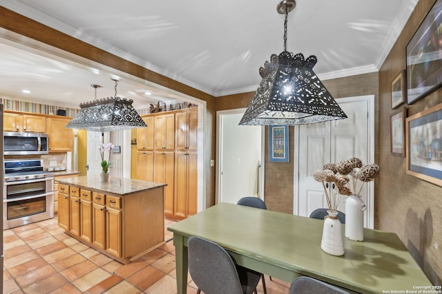 261 Fair Oaks, Alamo Heights, TX 78209 - kitchen featuring appliances with stainless steel finishes, decorative light fixtures, a center island, light stone counters, and crown molding
