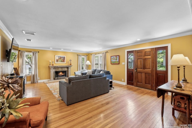 261 Fair Oaks, Alamo Heights, TX 78209 - living area featuring light wood-type flooring, a lit fireplace, ornamental molding, recessed lighting, and baseboards