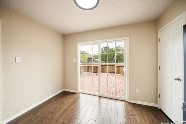 10438 Sun Ml, San Antonio, TX 78254 - unfurnished room with dark wood-style floors, baseboards, and a textured ceiling