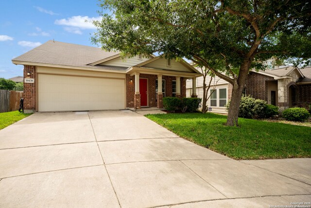 10438 Sun Ml, San Antonio, TX 78254 - view of front of house featuring brick siding, concrete driveway, and an attached garage