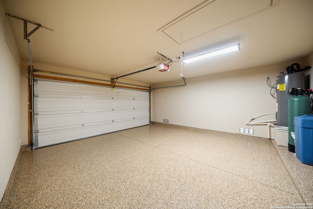 10438 Sun Ml, San Antonio, TX 78254 - garage featuring a garage door opener and water heater