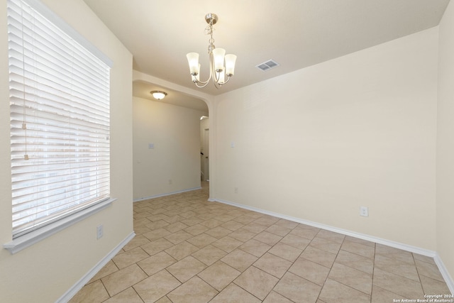 1407 Frio Eagle, San Antonio, TX 78245 - spare room with a chandelier, arched walkways, and baseboards