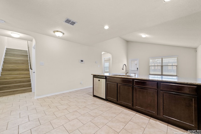 1407 Frio Eagle, San Antonio, TX 78245 - kitchen with dishwasher, a sink, vaulted ceiling, arched walkways, and dark brown cabinets
