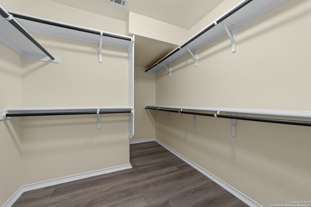 1407 Frio Eagle, San Antonio, TX 78245 - spacious closet featuring dark wood finished floors