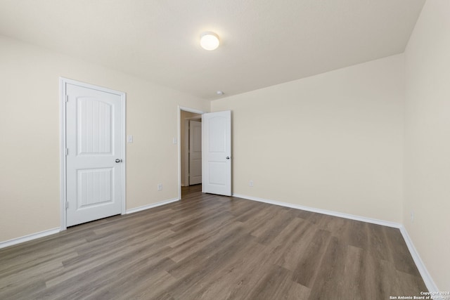 1407 Frio Eagle, San Antonio, TX 78245 - unfurnished bedroom with wood finished floors and baseboards
