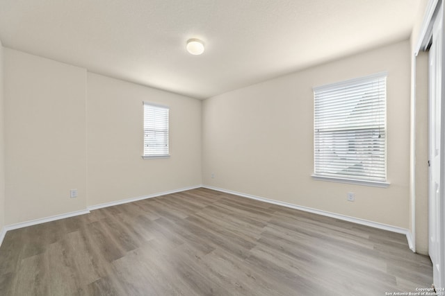 1407 Frio Eagle, San Antonio, TX 78245 - spare room featuring wood finished floors and baseboards