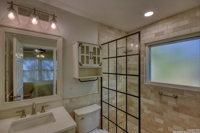255 Gilbert Ln, San Antonio, TX 78213 - ensuite bathroom with tile walls, walk in shower, toilet, vanity, and ceiling fan