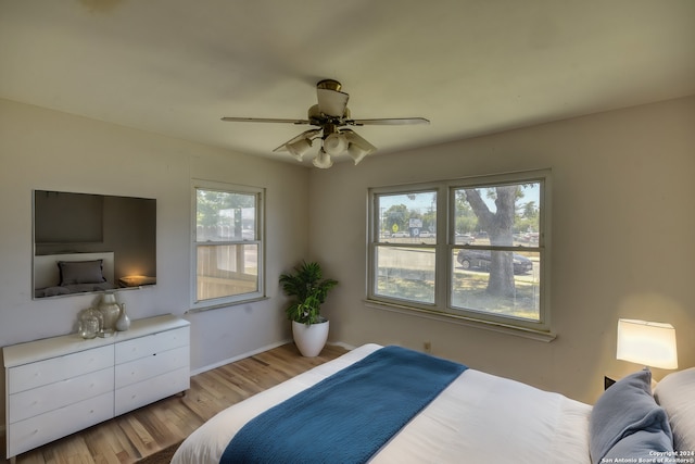 255 Gilbert Ln, San Antonio, TX 78213 - bedroom with wood finished floors, baseboards, and ceiling fan