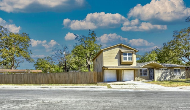 255 Gilbert Ln, San Antonio, TX 78213 - view of front of property with fence, an attached garage, and concrete driveway