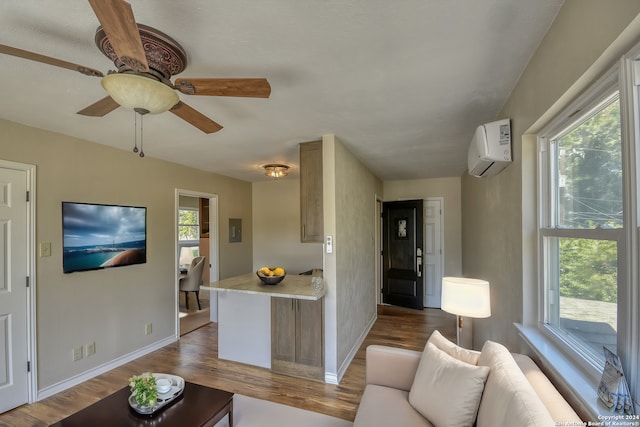 255 Gilbert Ln, San Antonio, TX 78213 - living room featuring a wall mounted AC, wood finished floors, baseboards, and ceiling fan