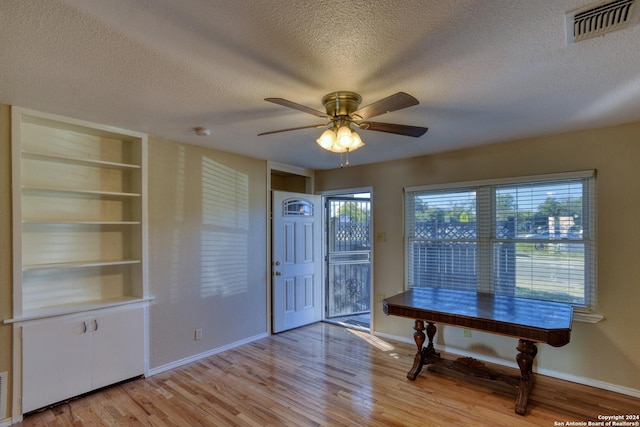 255 Gilbert Ln, San Antonio, TX 78213 - foyer featuring a ceiling fan, light wood-style floors, a textured ceiling, and baseboards