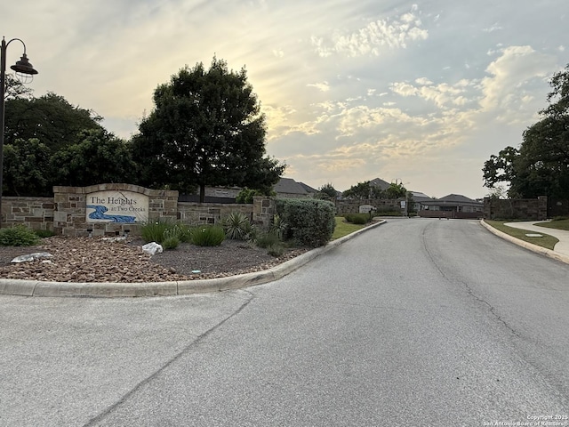 25725 Two Spgs, San Antonio, TX 78255 - view of asphalt road featuring curbs and a residential view