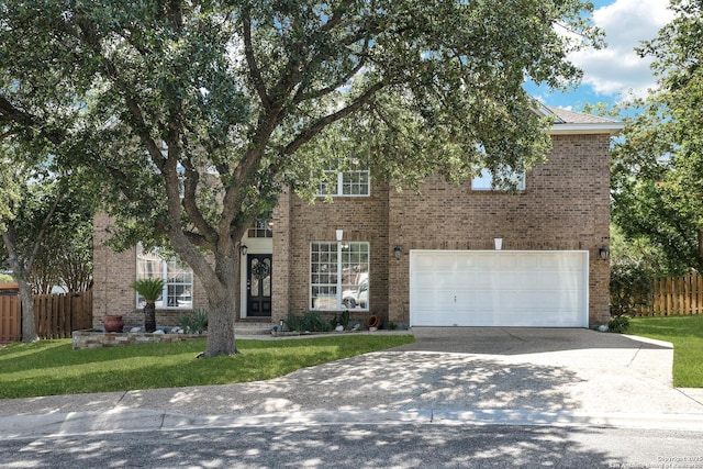 20607 Wild Spgs, San Antonio, TX 78258 - view of front of property with driveway, an attached garage, and brick siding