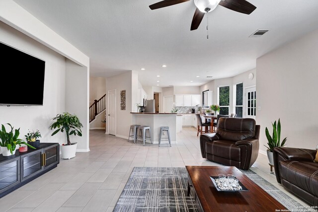 20607 Wild Spgs, San Antonio, TX 78258 - living area with stairs, ceiling fan, baseboards, recessed lighting, and light tile patterned flooring