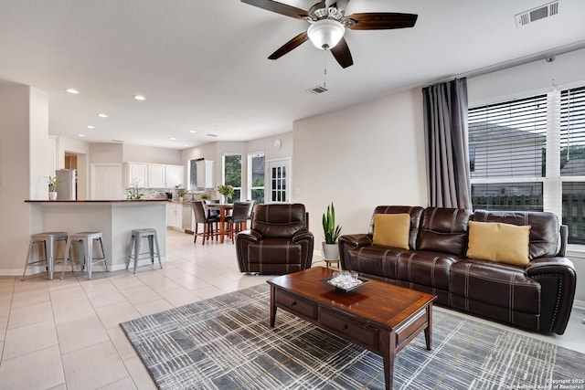20607 Wild Spgs, San Antonio, TX 78258 - living room with a ceiling fan, light tile patterned floors, recessed lighting, and baseboards