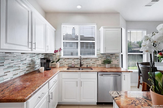 20607 Wild Spgs, San Antonio, TX 78258 - kitchen featuring stainless steel dishwasher, a sink, white cabinetry, tasteful backsplash, and recessed lighting