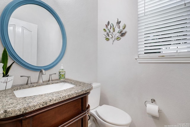 20607 Wild Spgs, San Antonio, TX 78258 - bathroom with toilet and vanity