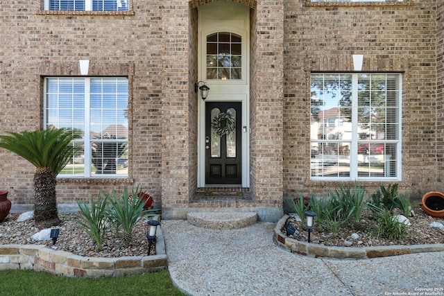 20607 Wild Spgs, San Antonio, TX 78258 - doorway to property with brick siding