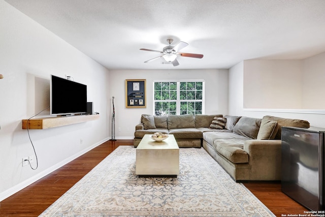 20607 Wild Spgs, San Antonio, TX 78258 - living area with ceiling fan, dark wood-style floors, and baseboards