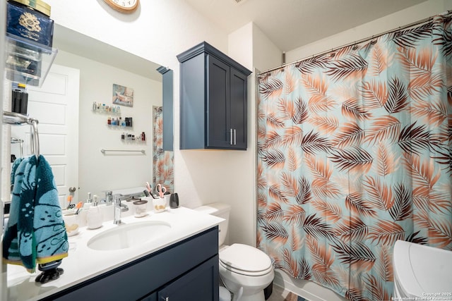 4919 Village Park, Marion, TX 78124 - bathroom featuring toilet, vanity, and a shower with shower curtain