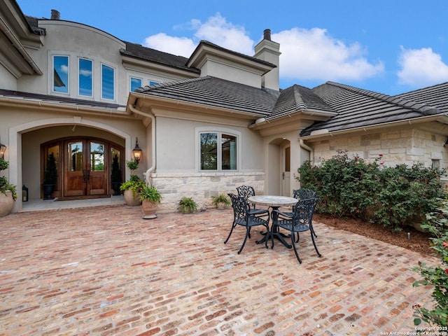 52 Oakland Hls, Boerne, TX 78006 - view of patio with french doors and outdoor dining area