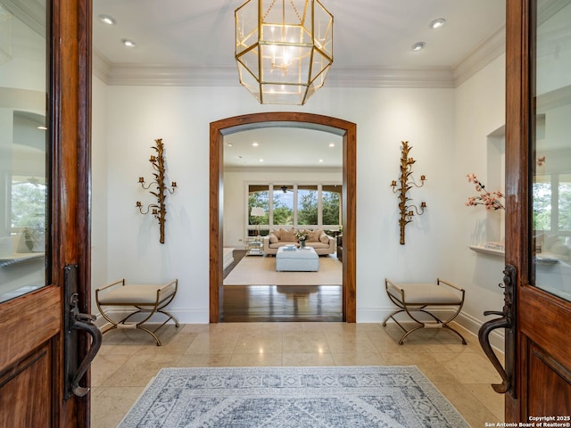 52 Oakland Hls, Boerne, TX 78006 - foyer entrance with a chandelier, ornamental molding, arched walkways, baseboards, and recessed lighting