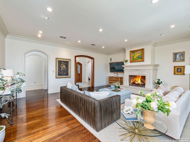 52 Oakland Hls, Boerne, TX 78006 - living room featuring arched walkways, wood finished floors, recessed lighting, crown molding, and baseboards