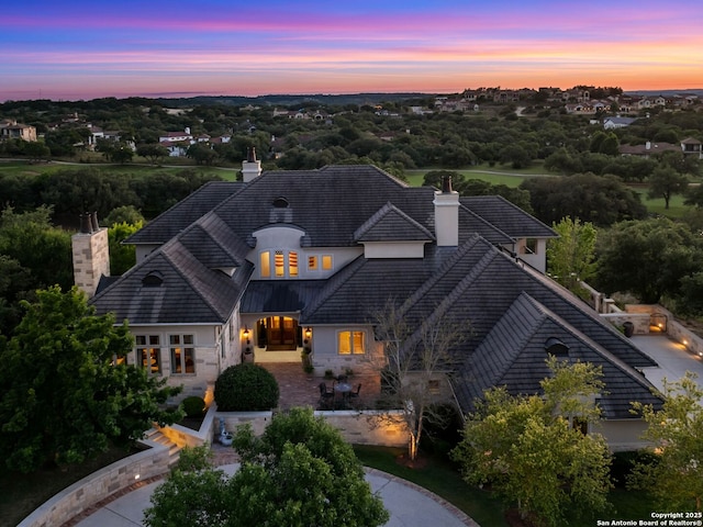 52 Oakland Hls, Boerne, TX 78006 - view of front of house featuring a chimney and stucco siding