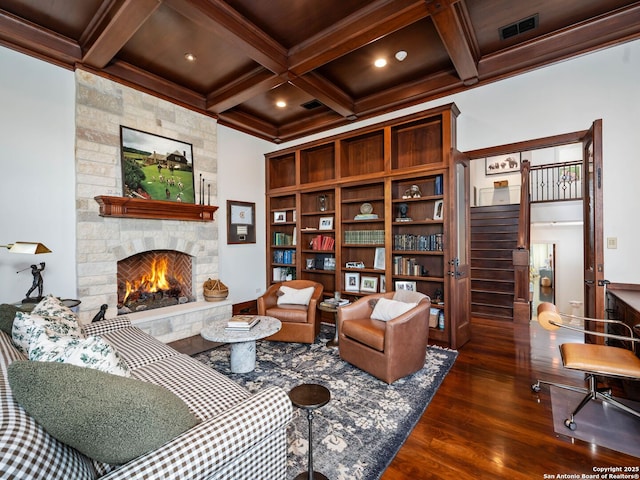 52 Oakland Hls, Boerne, TX 78006 - living area with a stone fireplace, coffered ceiling, dark wood finished floors, beam ceiling, and recessed lighting