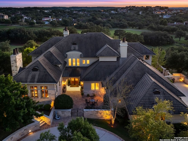 52 Oakland Hls, Boerne, TX 78006 - french country style house with a chimney, a patio, and stucco siding