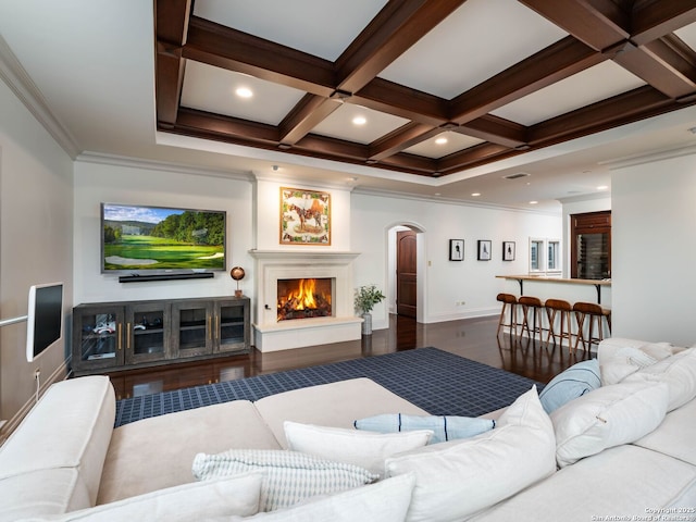 52 Oakland Hls, Boerne, TX 78006 - living area featuring arched walkways, beamed ceiling, coffered ceiling, wood finished floors, and crown molding