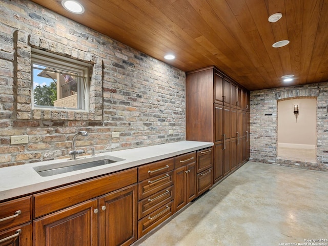 52 Oakland Hls, Boerne, TX 78006 - bar featuring a sink, wooden ceiling, recessed lighting, concrete flooring, and brick wall
