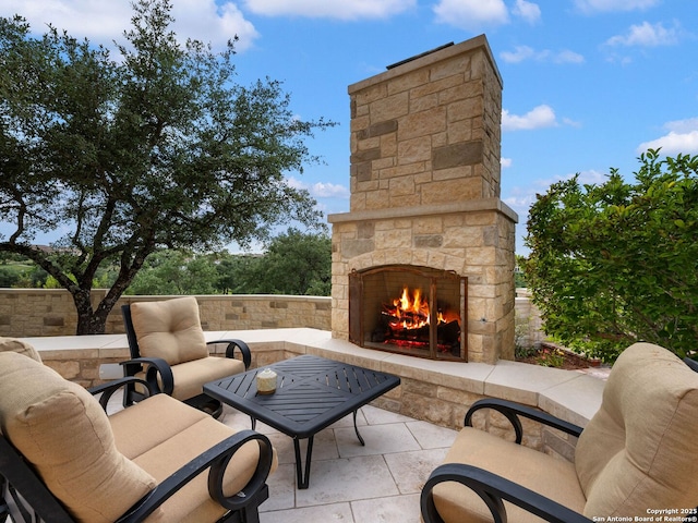52 Oakland Hls, Boerne, TX 78006 - view of patio / terrace with an outdoor stone fireplace