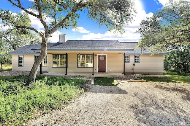 661 Abels Way, Canyon Lake, TX 78133 - single story home featuring a chimney and a porch