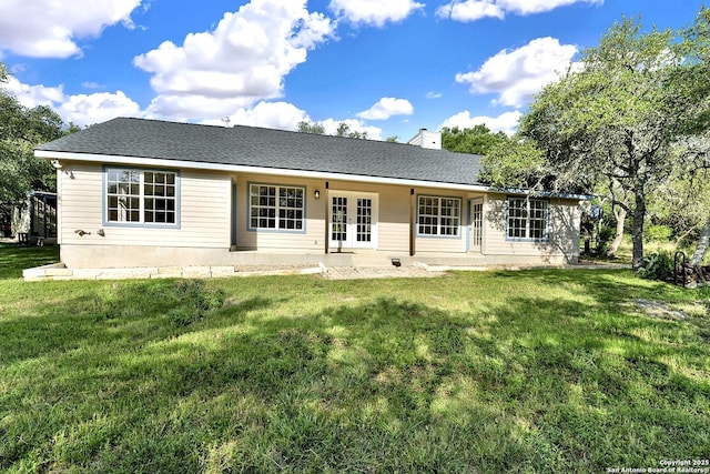 661 Abels Way, Canyon Lake, TX 78133 - back of house featuring french doors, a lawn, a chimney, and a patio area