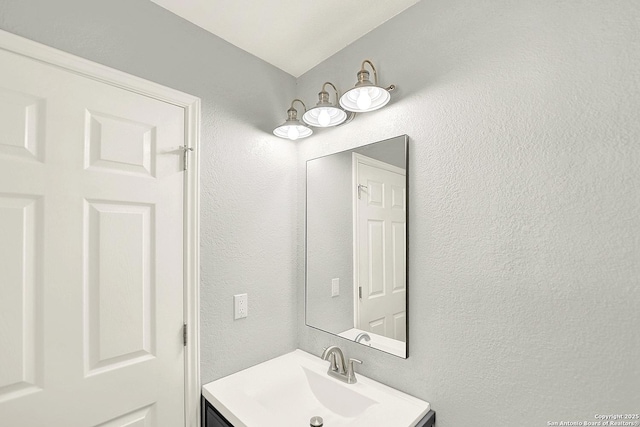 661 Abels Way, Canyon Lake, TX 78133 - bathroom featuring vanity and a textured wall