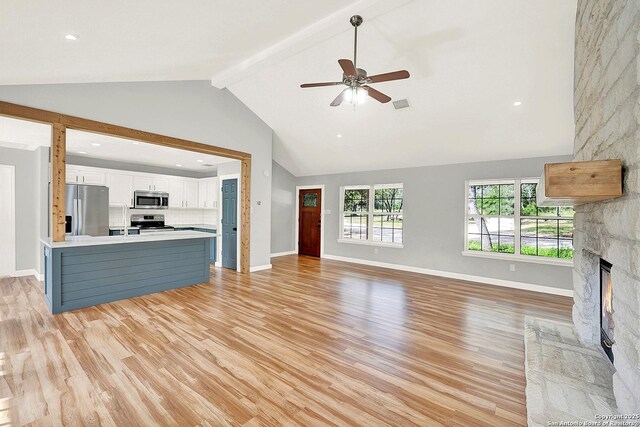 661 Abels Way, Canyon Lake, TX 78133 - unfurnished living room featuring light wood-style flooring, a fireplace, baseboards, and recessed lighting