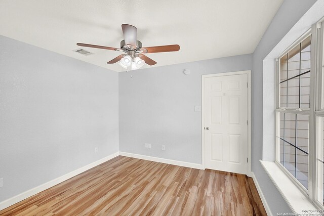 661 Abels Way, Canyon Lake, TX 78133 - spare room featuring wood finished floors, baseboards, and a ceiling fan