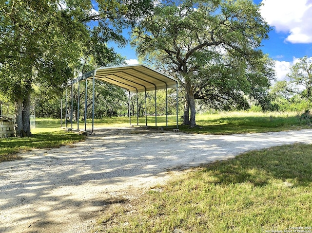 661 Abels Way, Canyon Lake, TX 78133 - view of home's community featuring gravel driveway, a carport, and a yard