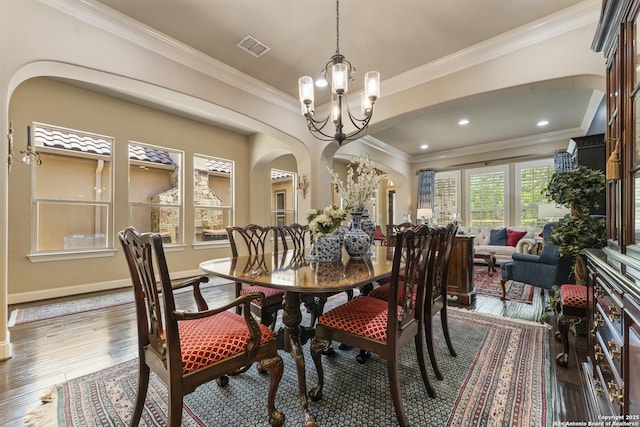 135 Penns Way, Shavano Park, TX 78231 - dining room featuring arched walkways, a chandelier, ornamental molding, hardwood / wood-style floors, and baseboards