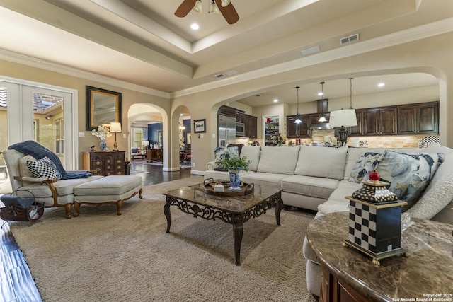 135 Penns Way, Shavano Park, TX 78231 - living area featuring arched walkways, a tray ceiling, a ceiling fan, recessed lighting, and ornamental molding