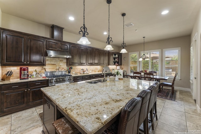 135 Penns Way, Shavano Park, TX 78231 - kitchen featuring under cabinet range hood, a sink, high end range, backsplash, and recessed lighting
