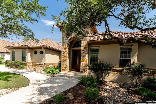 135 Penns Way, Shavano Park, TX 78231 - mediterranean / spanish-style home featuring stucco siding, stone siding, and a tiled roof